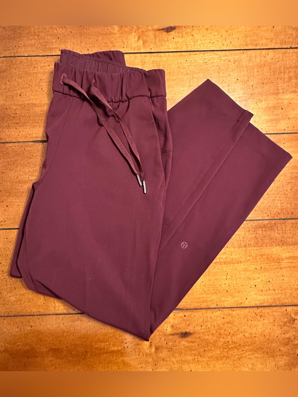 Lululemon On The Fly pants in a maroon or dark adobe color womens size 4